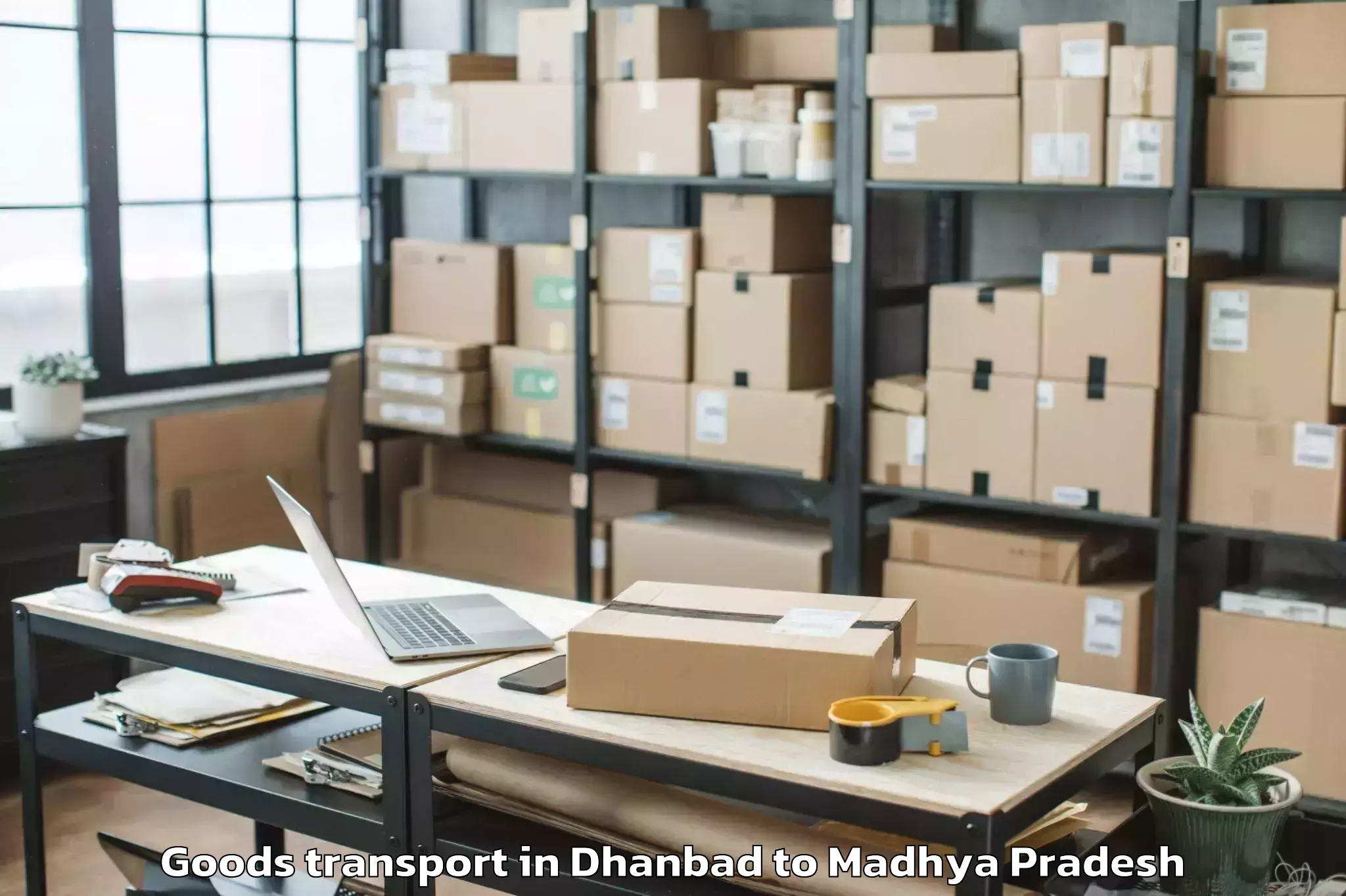 Reliable Dhanbad to Barnagar Goods Transport